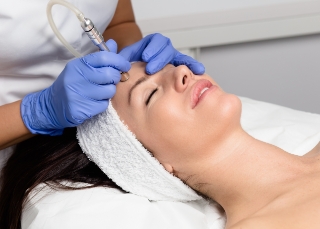 Dermatologist - Professional performing facial treatment